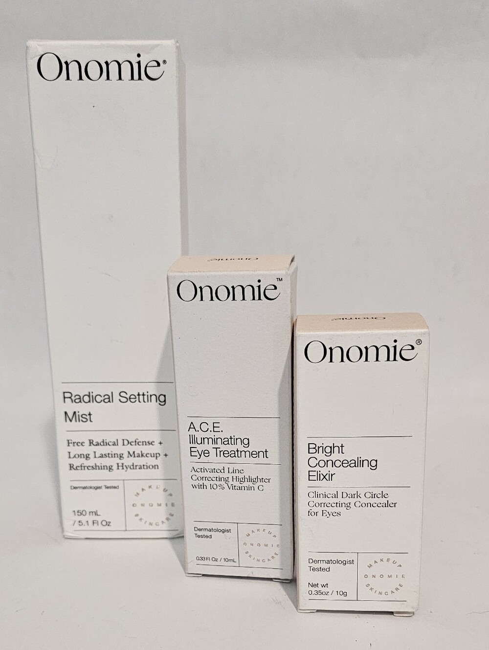 Onomie 3 Piece Set Concealor, Correcting Highlighter And Setting Spray NIB
